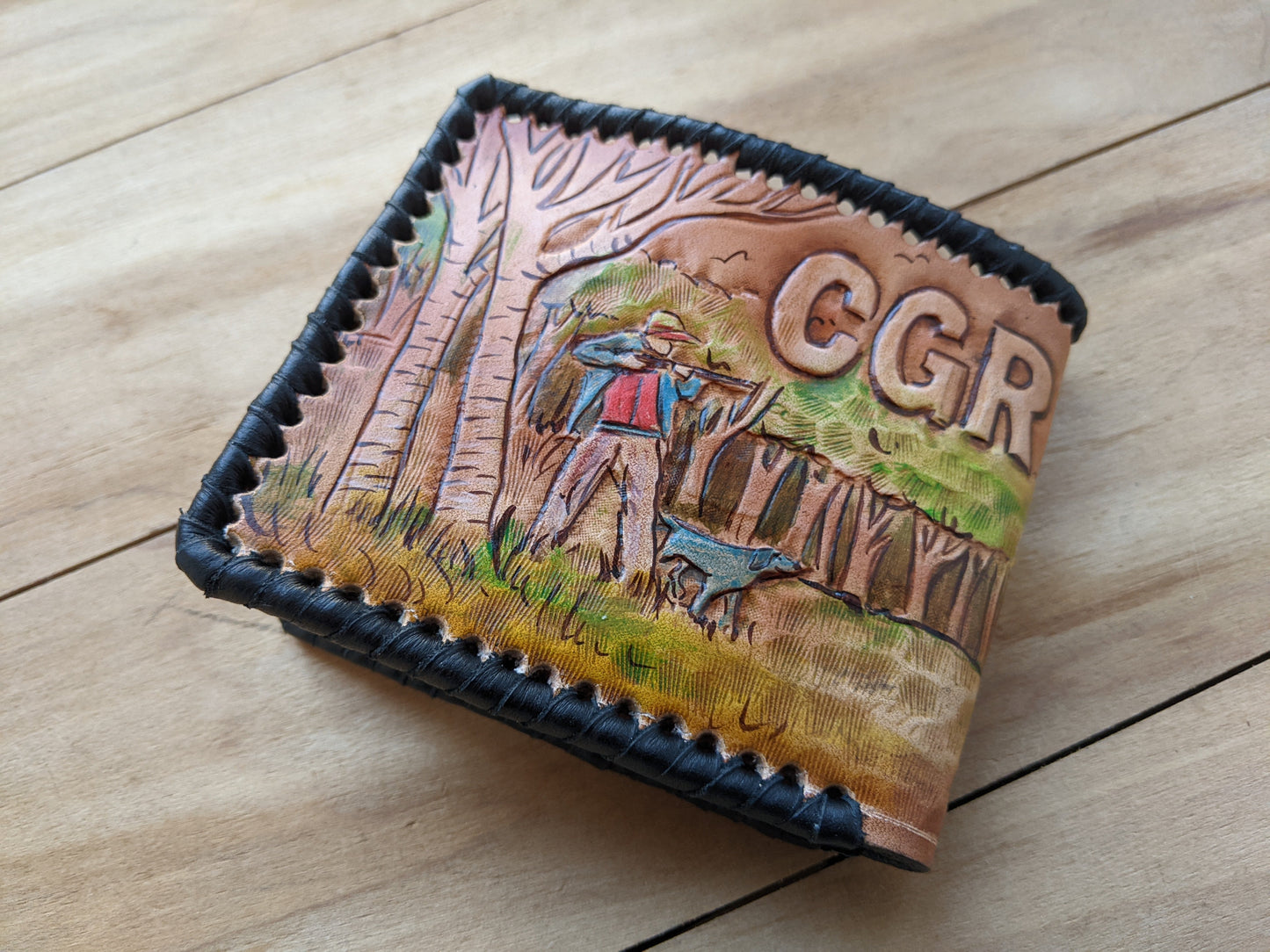 Shop the Hunter's Leather Wallet with pheasant hunting scene and rifle design. Handmade, RFID-protected, and perfect for outdoorsmen or as a Father's Day gift.