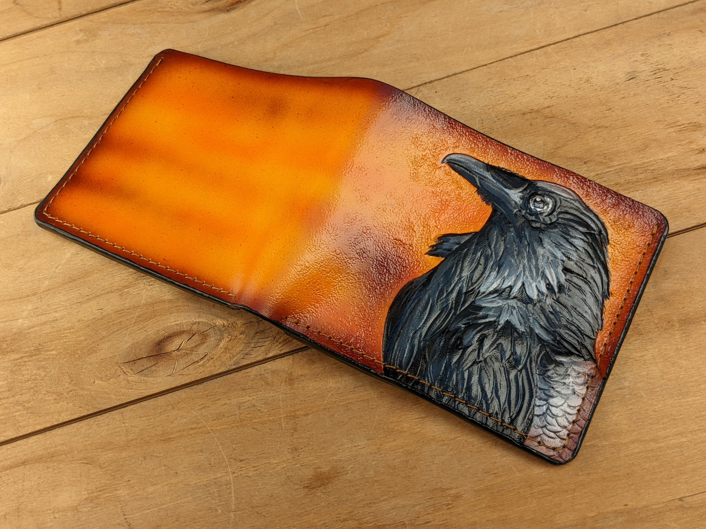 Handmade Odin Raven Huginn & Muninn bifold leather wallet. Embossed Crow with gothic fantasy art. Features RFID protection.