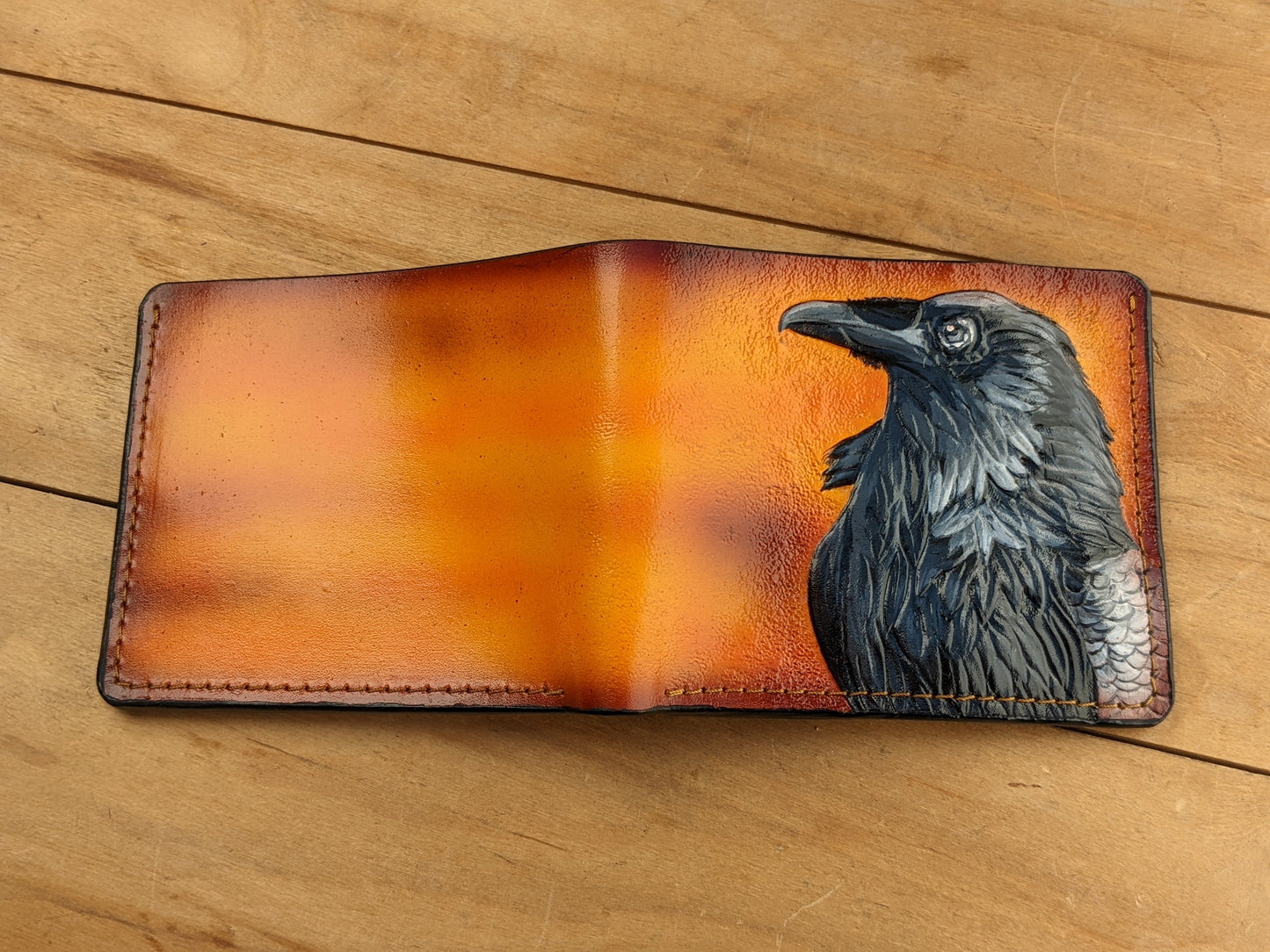 Handmade Odin Raven Huginn & Muninn bifold leather wallet. Embossed Crow with gothic fantasy art. Features RFID protection.