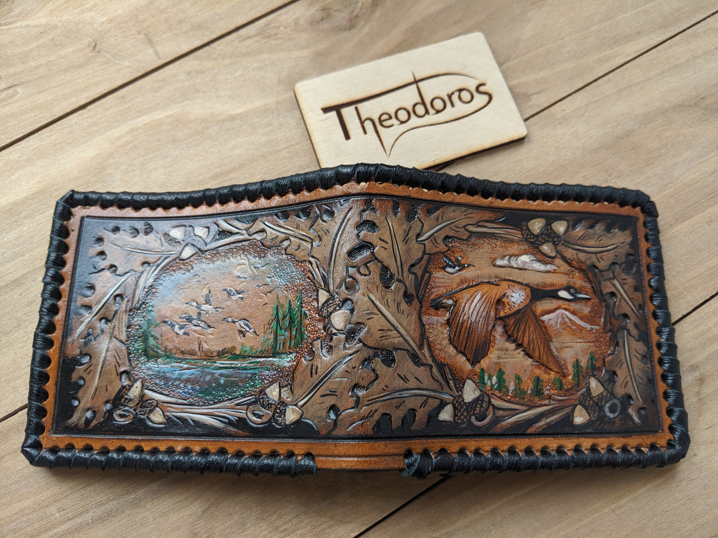 Shop the Goose Hunting Leather Wallet! Featuring oak leaf embossing and RFID protection, this handmade wallet is a perfect Father's Day gift for outdoorsmen.