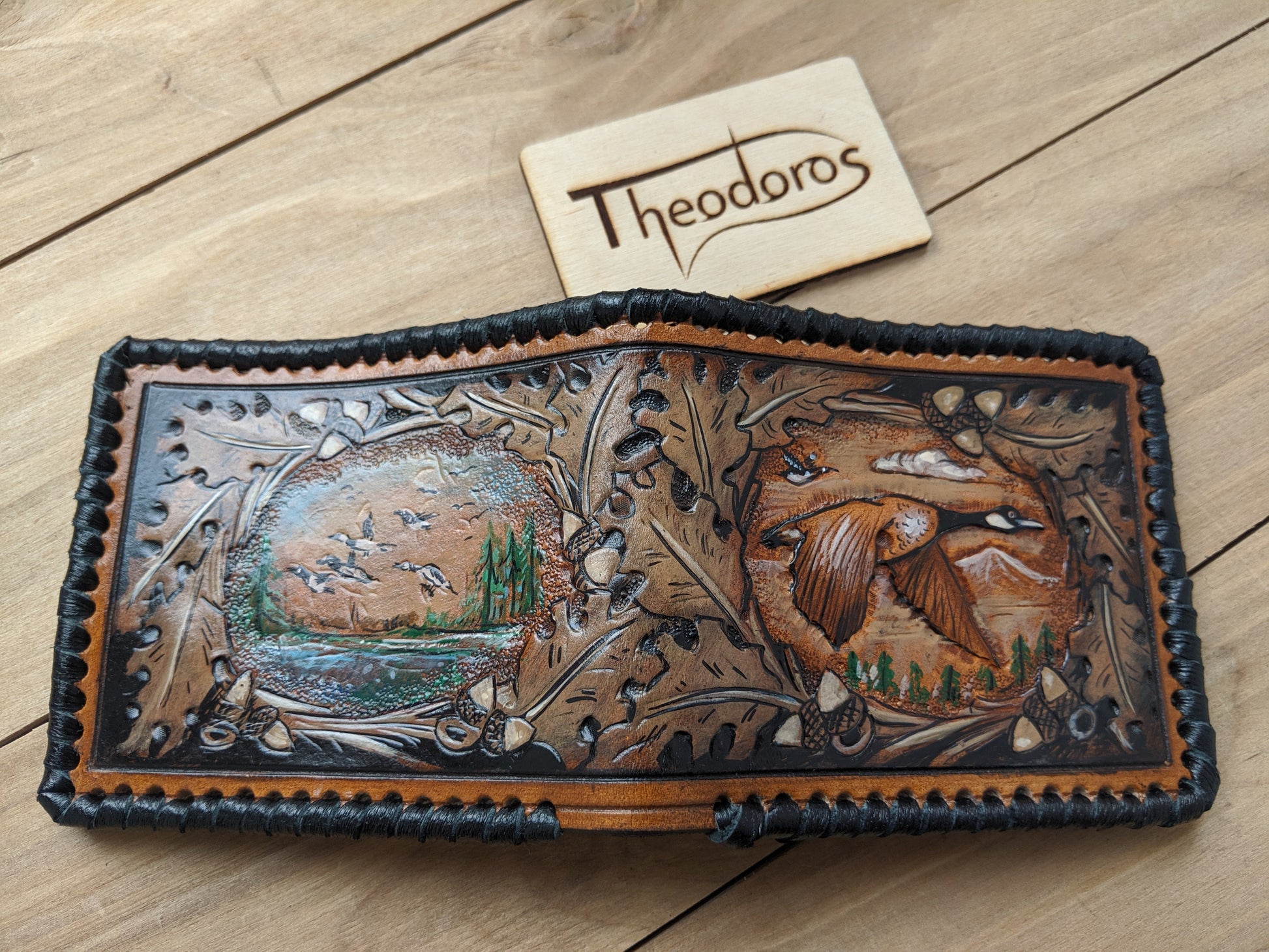 Shop the Goose Hunting Leather Wallet! Featuring oak leaf embossing and RFID protection, this handmade wallet is a perfect Father's Day gift for outdoorsmen.
